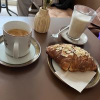 Flat white, chai latte and almond croissant.   at Cafe Harepus in Aarhus