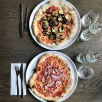 Eggplant pizza and a bolognese pizza. Both delicious. at Mama Earth in Salzburg