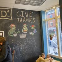 Inside with mother and child playing a game at D2 Java in Exeter