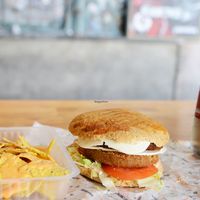 Double vegan burger with vegan cheese at Gopal - Vegan Deli in Barcelona