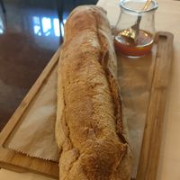 Traditional artisan wheat germ bread and tomato solmnjero. at La Tizna - Casa de Comidas Sostenible in Sevilla