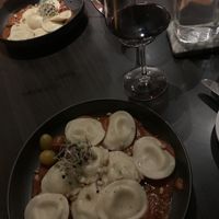 Vegan Ravioli filled with almond mozzarella in arrabbiata sauce  at Grappa in Dorado