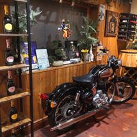 Vintage motorbike on display inside. at Shivalli in Leicester