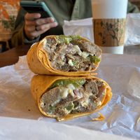 Vegan Philly cheesesteak on sun dried tomato wrap 🌯   at Yorgo's Bageldashery in Norfolk
