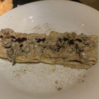 PACCHERI FUNGHI E SALSICCIA E TARTUFO Truffle and mushroom pasta with cashew cream and sausage.   at Choose in Madrid