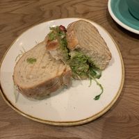 Vegan bread with pea smash, walnuts, pomegranates and tahini dressing  at Birdie & Co - Bagelstraße in Dusseldorf