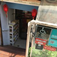 Entrance to inside; those in wheelchairs must ring the bell for help. at Happy Veggie Restaurant in New York City