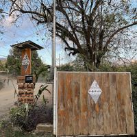 Gate & Road Sign at Indómitos Café & Bar in Uvita
