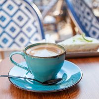 Oat milk cappuccino and vegan cheese cake at au contraire in Freiburg