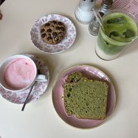 Pink babychino, choc chip cookie, pistatio cake and an iced matcha! 💚🩷 heaven   at OM NOM NOM CAFÉ in Munich