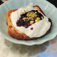 French Toast with Mascarpone cream, Berry Marmelade and pistacchio at OM NOM NOM CAFÉ in Munich