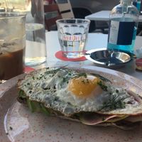 Vegan Fredo cappuccino and really tasty sourdough toast with egg, watermelon radish, avocado slices and tomato at Joshua Tree Cafe in Athens