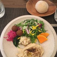 Hummus with salad and 3 deli items.  at PEACE TABLE - 渋谷 道玄坂店 in Tokyo