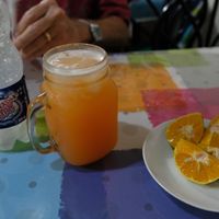 Drinks and orange at Soda La Casita de Yaki in San Jose
