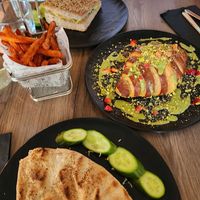 White chocolate croissant, sweet potato fries, spinach quesadilla, omelet sandwich at Elysian Restaurant in Nicosia