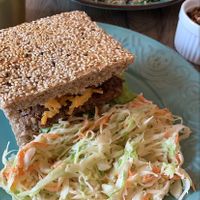 Signature Burger with Coleslaw Salad at Elysian Restaurant in Nicosia