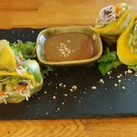 Vegan avocado and mango summer rolls with salad leaves, peanut sauce and vegan green mayo dots.  at Be Right Back in Linz