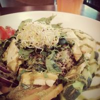 Protein Buddha Bowl with fresh carrot juice at Veggie Garden in Sitges