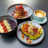 Superfood açaí bowl, Rootella pancakes, avocado toast, flat white with oat milk at Roots - Maschinenstraße in Zurich