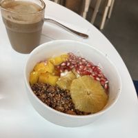 Granola bowl and latte with almond milkk  at Roots - Maschinenstraße in Zurich