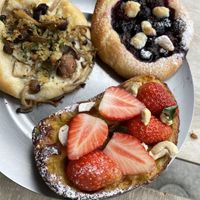 Raspberry-blueberry-chocolate bread, strawberry cashew custard bread, mushroom cream bread  at Universal Bakes and Cafe in Tokyo