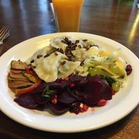 Vegan pierogi and fresh squeezed orange juice (some sips missing already) for about 6.20 €) at Glonojad in Krakow