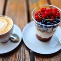 Had a cappuccino and the Greek yogurt berry bowl at Glonojad in Krakow