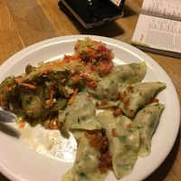 Only remembered to take after starting to eat! Vegan lentil dumplings with sauerkraut and pickle salad. at Glonojad in Krakow