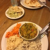 Curry and burrito with salads at Glonojad in Krakow