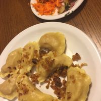 Vegan pierogi with two salads at Glonojad in Krakow