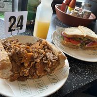 Breakfast Philly Cheesesteak and a vegan sandwich with a pineapple juice (I think)   at Nourish Philly in Philadelphia