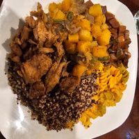 Divine platter: Quinoa, Mac n Cheese, jerk beef, mushrooms & butternut squash, and vegan oxtail. at Nourish Philly in Philadelphia