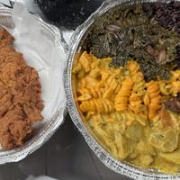 One giant piece of chick’un and a divine platter with 5 selections. (Black rice, oxtail, curry plantain, Mac n cheez, sautéed kale)  at Nourish Philly in Philadelphia