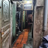 on the left side you will see this that leads you up the stairs to the restaurant at Katze Vegan & Vegetarian  in Hanoi