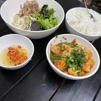 Fresh rice and tofu in tomato sauce as one of the free side dishes  at Katze Vegan & Vegetarian  in Hanoi