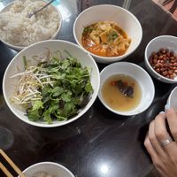 free starters! tofu, rice, greens, peanuts  at Katze Vegan & Vegetarian  in Hanoi