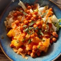 Hot summer salad with roasted chickpeas, mango, mint and coconut flakes at dreams Beach House in Ter Heijde
