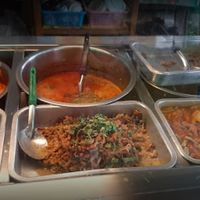 Trays & pots of food at Vegetarian Food by Somjan in Lampang