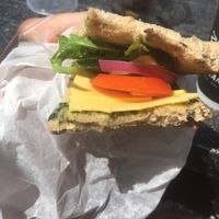 Vegan sandwich — fresh vegetables, rocket, pesto, whole wheat bread and vegan yellow cheese  at Cafe Katan ba Rashi  in Ramat Gan