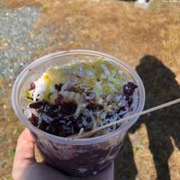 Açaí bowl with banana, coconut shreds and mango drizzle at Sandy Pony Donuts in Chincoteague