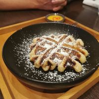 Waffles with a delicious passionfruit sauce at Chi in Vancouver