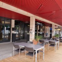 Exterior and outdoor seating at Pier 41 in Zug