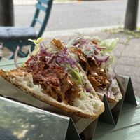 Two delicious fresh fiöners, one spicy, in their rack  at Vamos Veganos in Berlin
