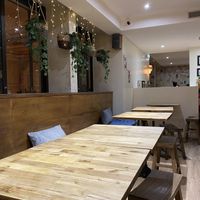 Seating area on top floor  at Neko Ramen in Paris