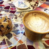 Oat milk latte and vegan blueberry muffin  at Drifting Grounds in Ocean View