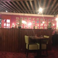 Spacious dining room with beautiful photos on the wall at Coppers in Hythe