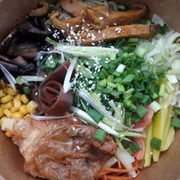 All the goodies of the vegan ramen, the soup is in a separate cup so that you can add it 'a la minute' at Cudo Vegan Sushi in Poznan