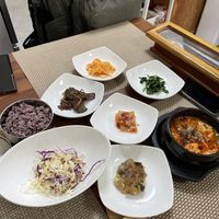 Spicy tofu stew with so many sides   at Soban Vegan 소반 비건식당 in Busan