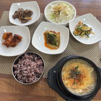 Spicy soft tofu soup and sides  at Soban Vegan 소반 비건식당 in Busan