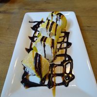 Eispalatschinke - French crepe style dough filled with ice-cream at Vevi in Vienna